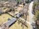 Aerial view of a single-Gathering home with a well-maintained yard and mature trees at 3606 Trickum Ne Rd, Marietta, GA 30066