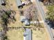 Expansive aerial view of home featuring a large, tree-filled lot with a nearby road at 3606 Trickum Ne Rd, Marietta, GA 30066