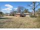 Wide shot of backyard of property featuring mature trees and a well-maintained lawn at 3606 Trickum Ne Rd, Marietta, GA 30066