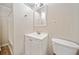 Bright bathroom with a white vanity, framed mirror, and a separate shower at 3606 Trickum Ne Rd, Marietta, GA 30066