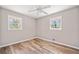 Inviting bedroom with natural light from two windows and sleek flooring at 3606 Trickum Ne Rd, Marietta, GA 30066