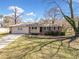 Single-story home featuring a brick and vinyl exterior, manicured lawn, and inviting front entrance at 3606 Trickum Ne Rd, Marietta, GA 30066