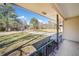 Inviting covered front porch with iron railing and a view of the spacious front yard at 3606 Trickum Ne Rd, Marietta, GA 30066