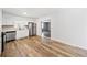 Well-lit kitchen featuring white cabinetry, stainless steel appliances, and contemporary flooring at 3606 Trickum Ne Rd, Marietta, GA 30066