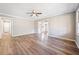 Spacious living room with fresh paint, modern ceiling fan and attractive light-colored flooring at 3606 Trickum Ne Rd, Marietta, GA 30066