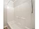 All-white shower features built-in shelving, a tub, and a detachable shower head at 3606 Trickum Ne Rd, Marietta, GA 30066