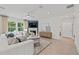 Inviting living room with a cozy fireplace, modern furniture, and plenty of natural light at 6094 Marigold Way, Atlanta, GA 30349