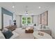 Upstairs living room with stylish furnishings, TV console and neutral colors at 6094 Marigold Way, Atlanta, GA 30349