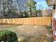 Fenced backyard featuring a grass yard and partial view of the house at 2257 Collins Dr, East Point, GA 30344