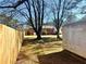 Backyard shed nestled behind a wooden fence, offering a private outdoor space at 2257 Collins Dr, East Point, GA 30344