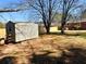 A backyard shed offers additional storage space beside a newly built wooden fence at 2257 Collins Dr, East Point, GA 30344