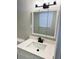 Bathroom vanity featuring a light countertop, white cabinets, and matte black faucet at 2257 Collins Dr, East Point, GA 30344