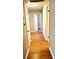 Hallway showcasing the hardwood floors with white painted doors at 2257 Collins Dr, East Point, GA 30344