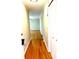 Inviting hallway with gleaming hardwood floors leading to the rest of the house at 2257 Collins Dr, East Point, GA 30344