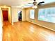 Open-concept living area featuring hardwood floors, large windows, and modern lighting at 2257 Collins Dr, East Point, GA 30344