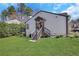 Picture of a well-maintained backyard with stairs leading to the entrance and a lush green lawn at 3242 Kingswood Gln, Decatur, GA 30034