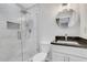 Modern bathroom featuring a tiled shower, granite counter, and round mirror at 3242 Kingswood Gln, Decatur, GA 30034