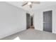 Bedroom featuring a ceiling fan, plush carpet and light gray paint at 3242 Kingswood Gln, Decatur, GA 30034