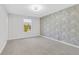Empty bedroom with gray chevron accent wall and carpeted floors at 3242 Kingswood Gln, Decatur, GA 30034