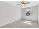 Neutral bedroom featuring a ceiling fan, plush carpet and a window at 3242 Kingswood Gln, Decatur, GA 30034