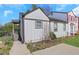 Charming home featuring neutral siding, dark trim and a welcoming front porch, set against a clear blue sky at 3242 Kingswood Gln, Decatur, GA 30034