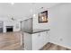 Kitchen island with dark countertop and white cabinets in a room with wood flooring at 3242 Kingswood Gln, Decatur, GA 30034