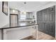 Modern kitchen with granite counters, stainless steel appliances, and gray cabinets at 3242 Kingswood Gln, Decatur, GA 30034