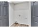 Empty laundry room with new vinyl floors and washer dryer hookups at 3242 Kingswood Gln, Decatur, GA 30034