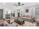 Open concept living room with access to a modern kitchen and hardwood floors at 3242 Kingswood Gln, Decatur, GA 30034