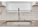 Stainless steel kitchen sink with modern faucet and white tile backsplash at 3242 Kingswood Gln, Decatur, GA 30034