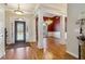 Bright home foyer with hardwood floors and decorative columns at 3277 Aberrone Pl, Buford, GA 30519