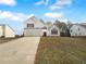 Charming two-story home featuring a two-car garage and landscaped front yard at 4200 Flakes Mill Manor Ln, Ellenwood, GA 30294