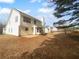 Spacious backyard with large white house and green lawn at 4200 Flakes Mill Manor Ln, Ellenwood, GA 30294