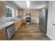 This Kitchen features stainless steel appliances, wooden cabinetry, and durable countertops at 4200 Flakes Mill Manor Ln, Ellenwood, GA 30294