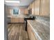This Kitchen features stainless steel appliances, wooden cabinetry, and durable countertop at 4200 Flakes Mill Manor Ln, Ellenwood, GA 30294