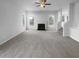 Living room with fireplace, neutral colors, and ample natural light at 4200 Flakes Mill Manor Ln, Ellenwood, GA 30294