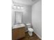 Powder room featuring modern vanity with sink and lighting, and wood-look flooring at 4200 Flakes Mill Manor Ln, Ellenwood, GA 30294