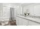 Well-lit bathroom featuring a double sink vanity and a shower-tub combination at 2021 Wyndham Pl, Conyers, GA 30013