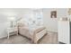 Cozy bedroom with a comfortable bed, soft lighting, and stylish furnishings at 2021 Wyndham Pl, Conyers, GA 30013