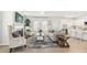 Cozy living room with fireplace, plush seating, ample natural light, and open kitchen access at 2021 Wyndham Pl, Conyers, GA 30013