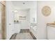 Spacious bathroom with bathtub and tiled shower that features dual vanities and gray flooring at 2021 Wyndham Pl, Conyers, GA 30013