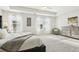 Spacious main bedroom with plush carpet, a large window, and a dresser at 2021 Wyndham Pl, Conyers, GA 30013