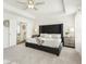 Large main bedroom with neutral tones, a plush carpet, and access to the en suite at 2021 Wyndham Pl, Conyers, GA 30013