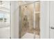 Spacious shower with tiled walls and glass doors conveniently located off the bathroom at 2021 Wyndham Pl, Conyers, GA 30013