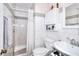 Bathroom with a standing shower with a shower curtain, toilet, and a sink at 2573 Mistletoe Ln, Snellville, GA 30039