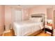 Bedroom with hardwood floors, large window and cozy décor at 2573 Mistletoe Ln, Snellville, GA 30039