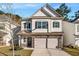 Charming two-story home with a welcoming front porch and a two-car garage with driveway at 158 Bryon Ln Ln, Acworth, GA 30102