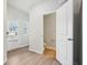 A half bathroom adjacent to the entry features a white toilet and door to the front yard at 2023 Wyndham Pl, Conyers, GA 30013