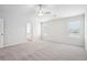 Bright and airy bedroom with a ceiling fan and large windows, offering plenty of natural light at 2023 Wyndham Pl, Conyers, GA 30013
