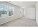 Bedroom boasts neutral walls, carpet, a double door closet, and natural light from two bright windows at 2023 Wyndham Pl, Conyers, GA 30013